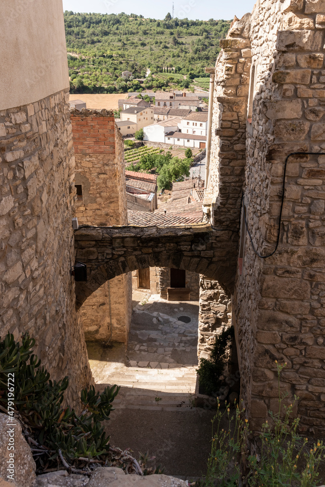 street with a medieval arch in the Spanish village of Guimera