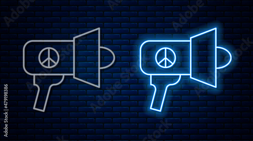 Glowing neon line Megaphone icon isolated on brick wall background. Speaker sign. Vector