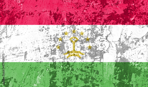 Tajikistan flag on old paint on wall. 3D image