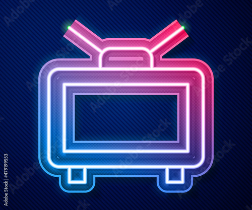 Glowing neon line Football soccer match on TV icon isolated on blue background. Football online concept. Vector