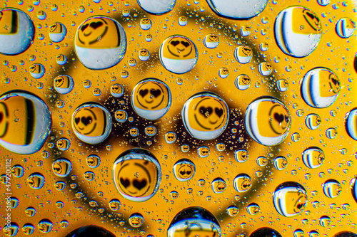 Water droplets on a glass in form of lenses with a colourful background. Wallpaper for screen. Abstract background.