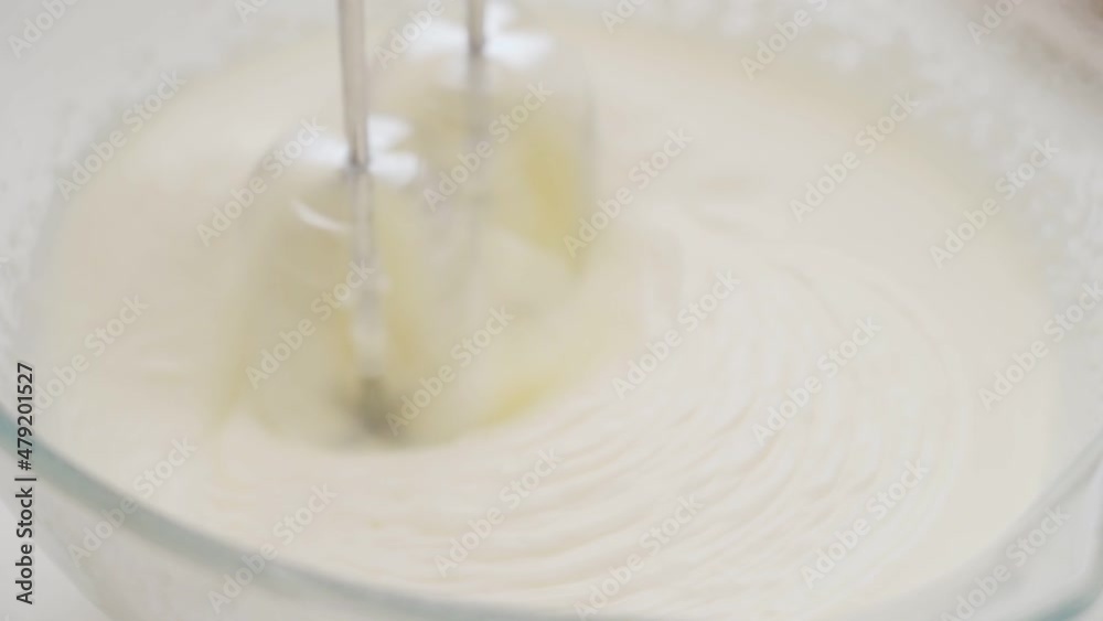 Close-up of a mixer whipping a batter Close-up of a mixer whipping a batter