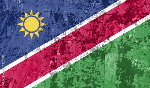 Namibia flag on old paint on wall. 3D image