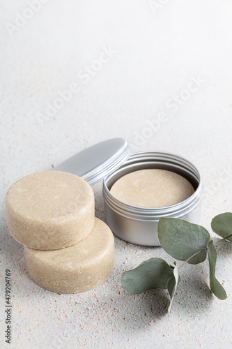 Eco friendly solid handmade colorful shampoo bars on light colored background close-up.