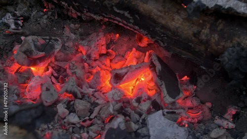 embers smouldering in the fire, a small explosion