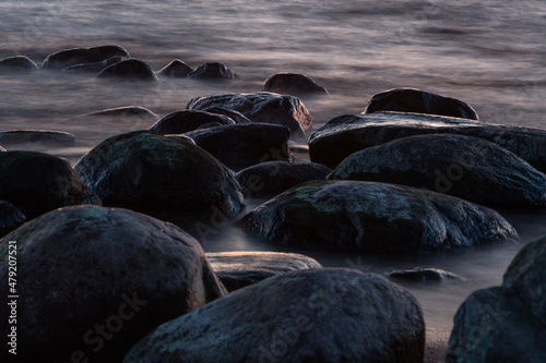 Fototapeta Naklejka Na Ścianę i Meble -  Rocky beach of the Baltic Sea at sunset