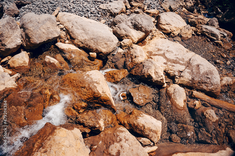 Beautiful large stones in the water. Close-up, soft focus. Beautiful large stones in the water. Close-up, soft focus.