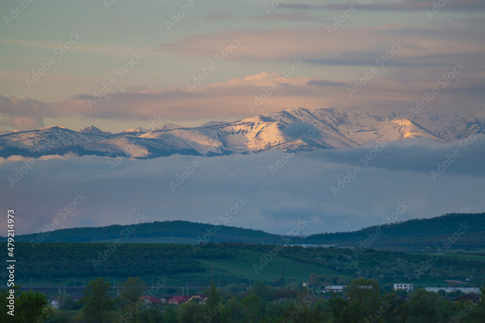 cover with snow mountains in the morning