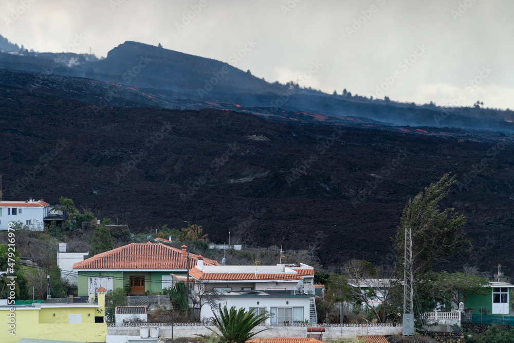 Lava flows over the houses of the canary island La Palma