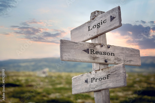 logic reason proof text quote on wooden signpost outdoors during sunset.