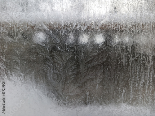 Icy frost patterns on the glass. Severe frost.