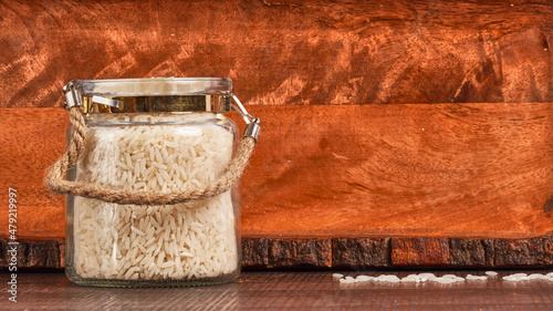 glass jar of white raw rice