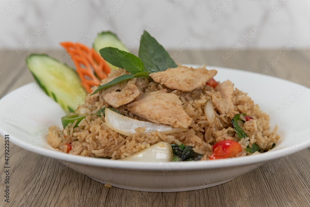 Generous helping of spicy fried rice with sliced chicken for a delicious pile of Thai food to eat Generous helping of spicy fried rice with sliced chicken for a delicious pile of Thai food to eat