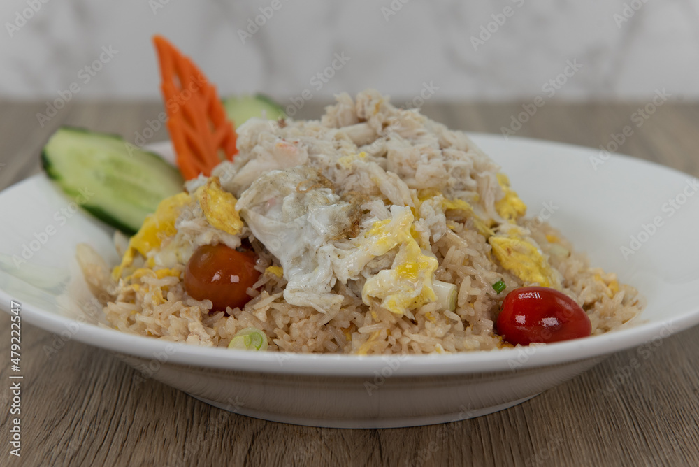 Generous helping of fried rice with shredded crab meat for a delicious pile of Thai food to eat Generous helping of fried rice with shredded crab meat for a delicious pile of Thai food to eat