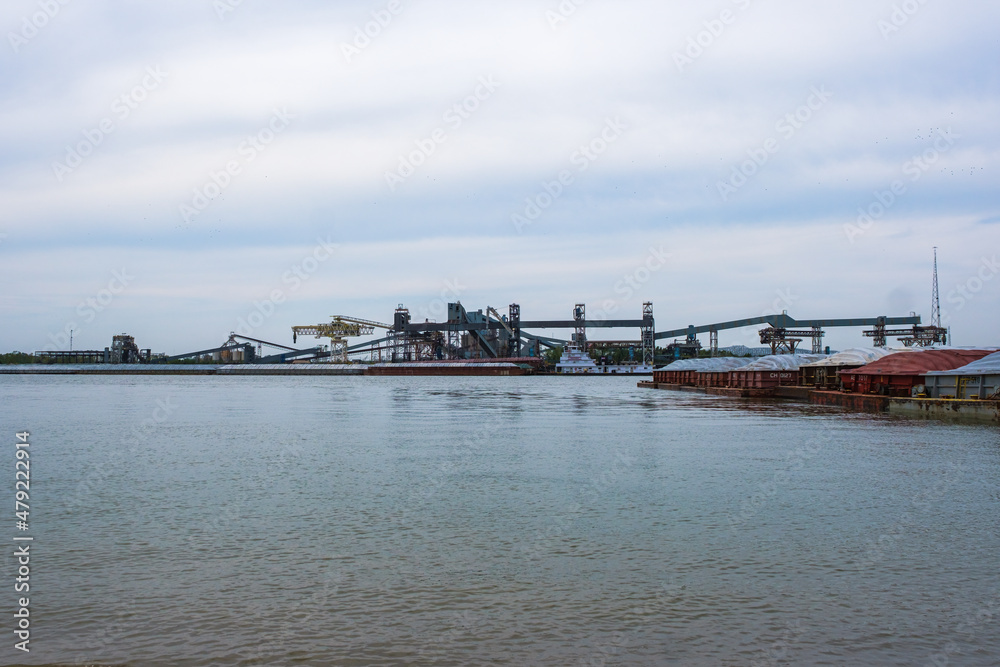 Industrial scene on the Mississippi River with grain elevator and