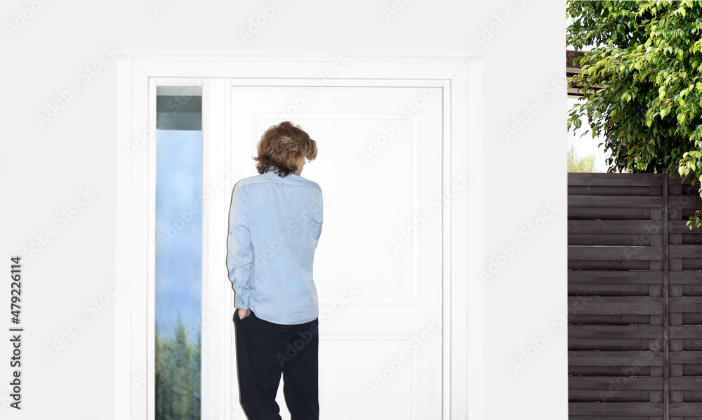 Man opening the door of her home.Inviting the guests Man opening the door of her home.Inviting the guests