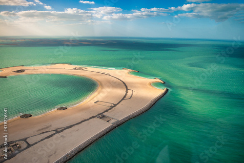 Aerial view of Dubai small island from helicopter. © jovannig