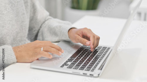 Close up of Hands of African Woman Working on Laptop