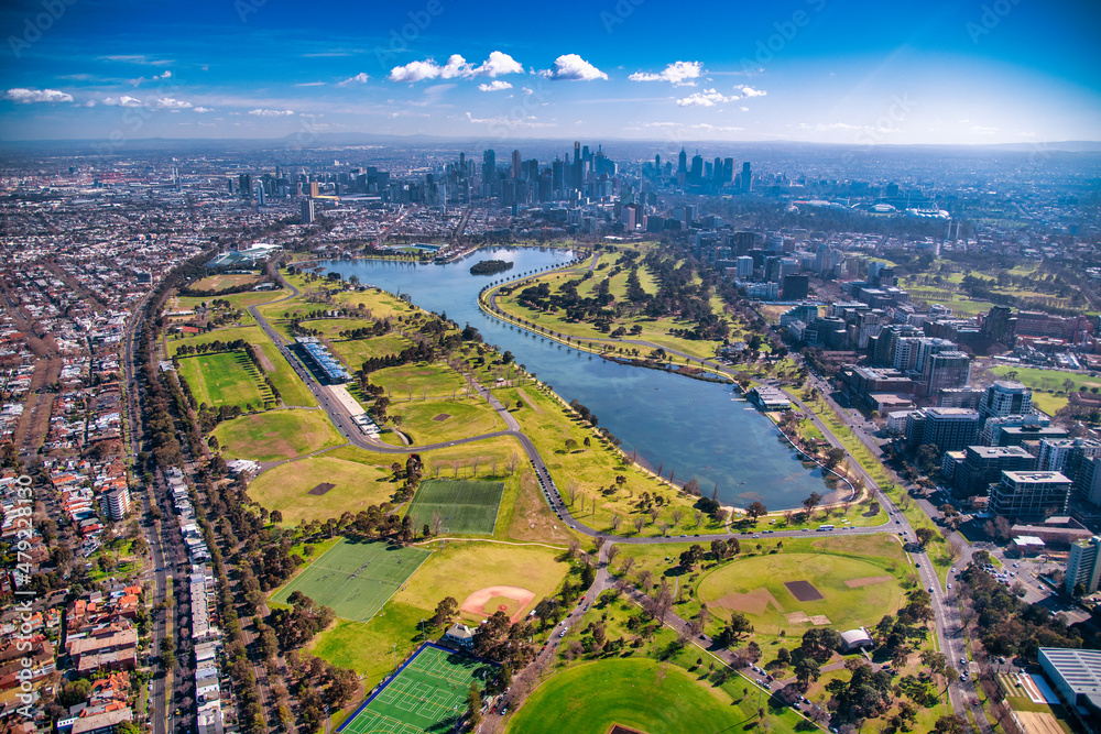 Obraz premium Melbourne, Australia. Aerial city skyline from helicopter. Skyscrapers, park and lake.