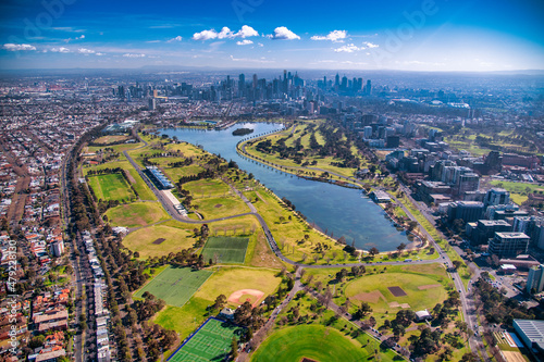Melbourne, Australia. Aerial city skyline from helicopter. Skyscrapers, park and lake.