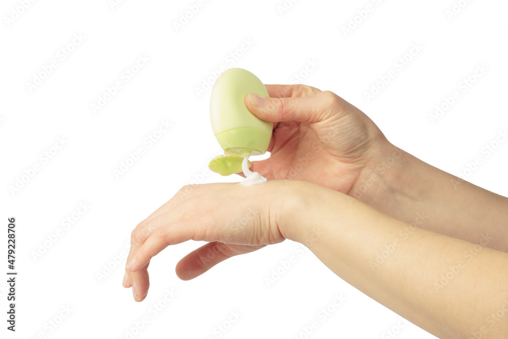 hands of a beautiful woman apply cream or balm, isolated on white background. hands of a beautiful woman apply cream or balm, isolated on white background.