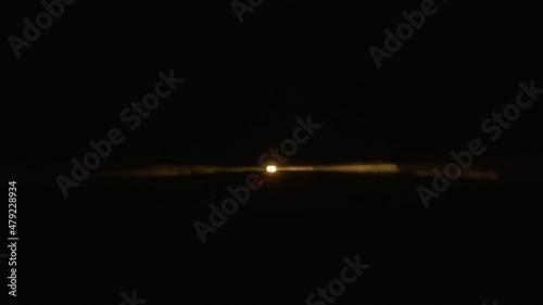 Night scene light house historic building landmark nature park, California 6K. Descent view rotating beam of Light house lantern illuminating thick foggy mist cloud by yellow light, shot on RED camera