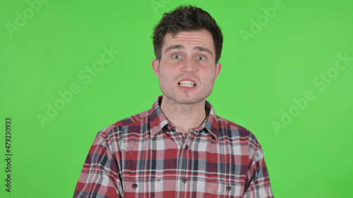 Portrait of Young Man Fighting, Arguing, Green Chroma Screen