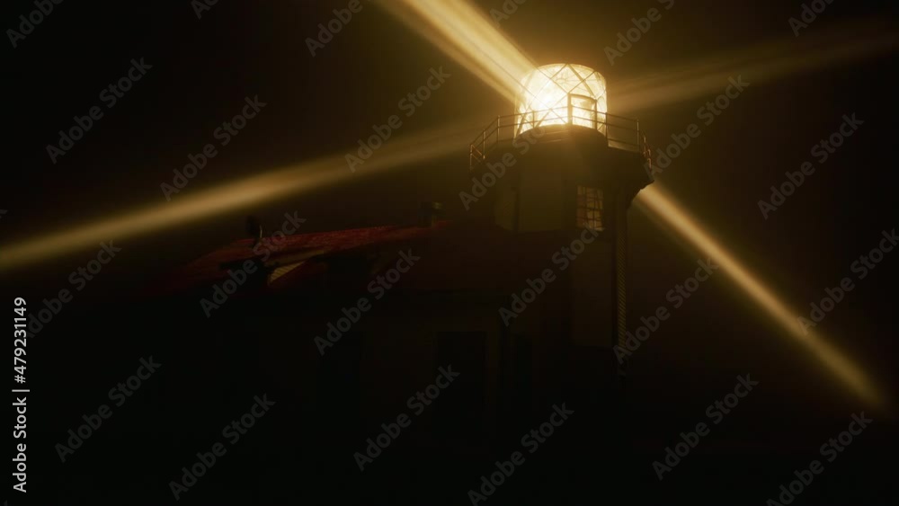 Close up view rotating beam of Light house lantern illuminating thick fog cloud by yellow light, shot on RED camera. Night scene at light house historic building landmark nature coastal park, USA