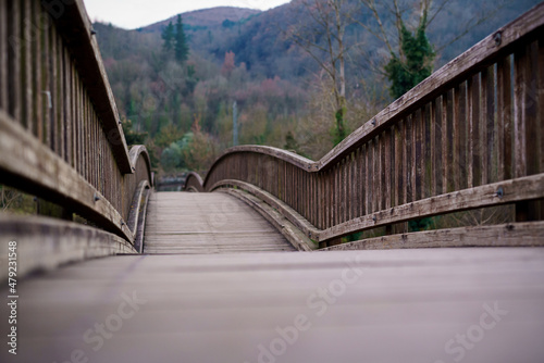 Nice wooden bridge over the river Fluvia. Castellfollit de la Roca is a town with one of the best views. It is built on top of a lava flow in La Garrotxa. photo