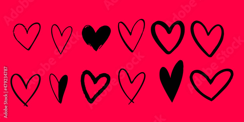Set of doodle hand drawn hearts at pink background.