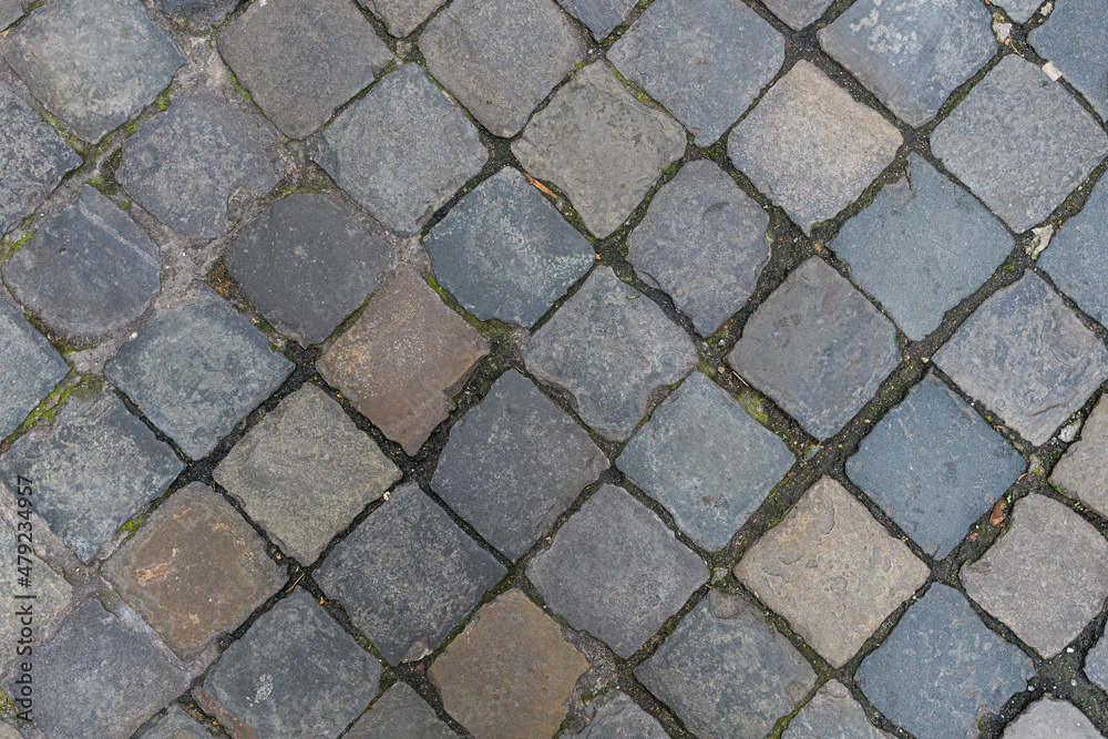 Paving slabs diagonally. The tiles are square-shaped, laid out diagonally. Street background motive Paving slabs diagonally. The tiles are square-shaped, laid out diagonally. Street background motive