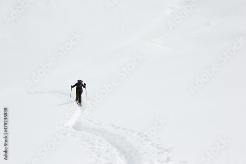follow the track or way in snow landscape ski touring in austria