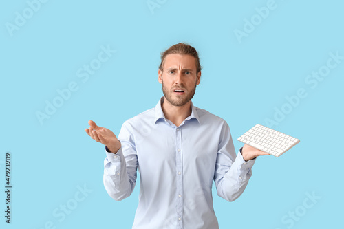 Confused man with keyboard ...