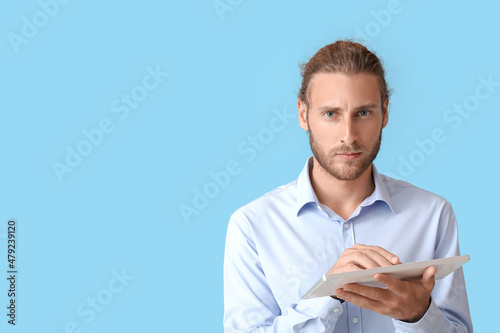Man with keyboard on color ...