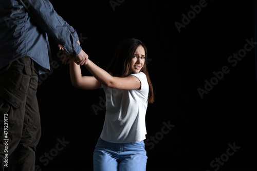 Man and his victim on dark ...