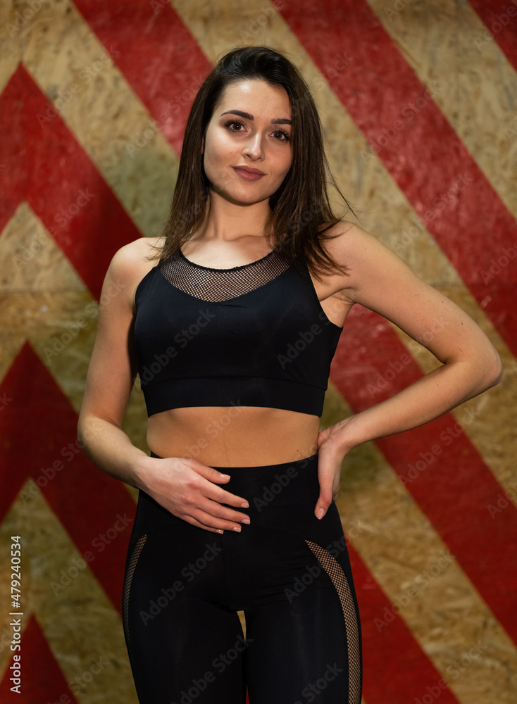 Fitness woman in black, trained female body, lifestyle portrait, caucasian model Fitness woman in black, trained female body, lifestyle portrait, caucasian model