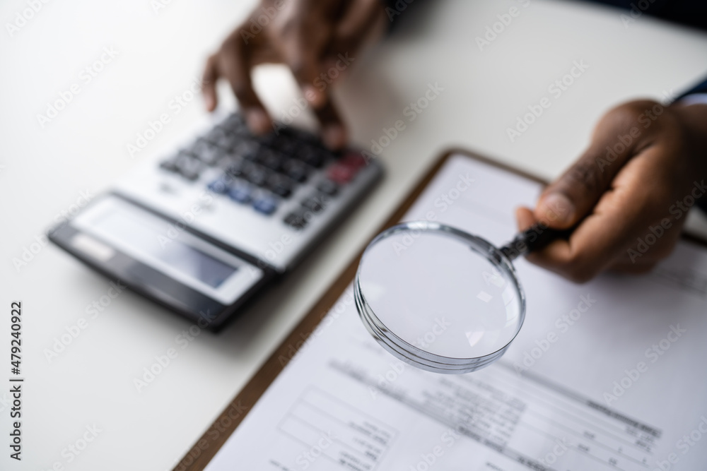 Business Fraud Investigation. Auditor Using Magnifying Glass Business Fraud Investigation. Auditor Using Magnifying Glass