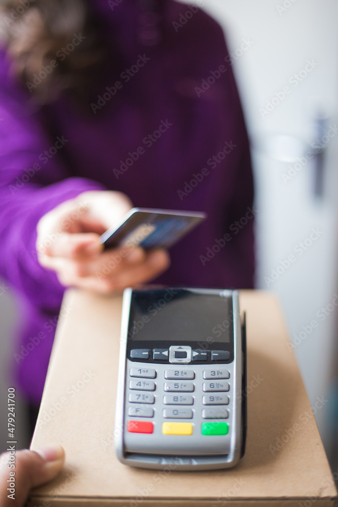 Woman making online payment for delivery