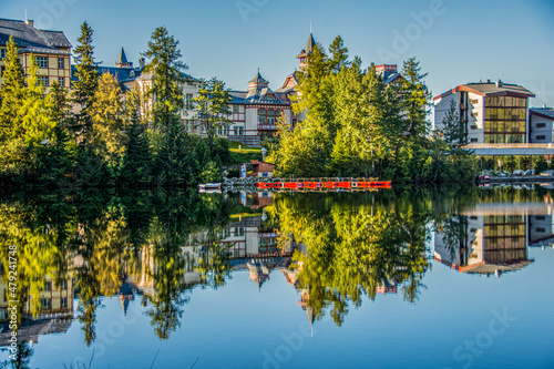 reflection of houses on the lake