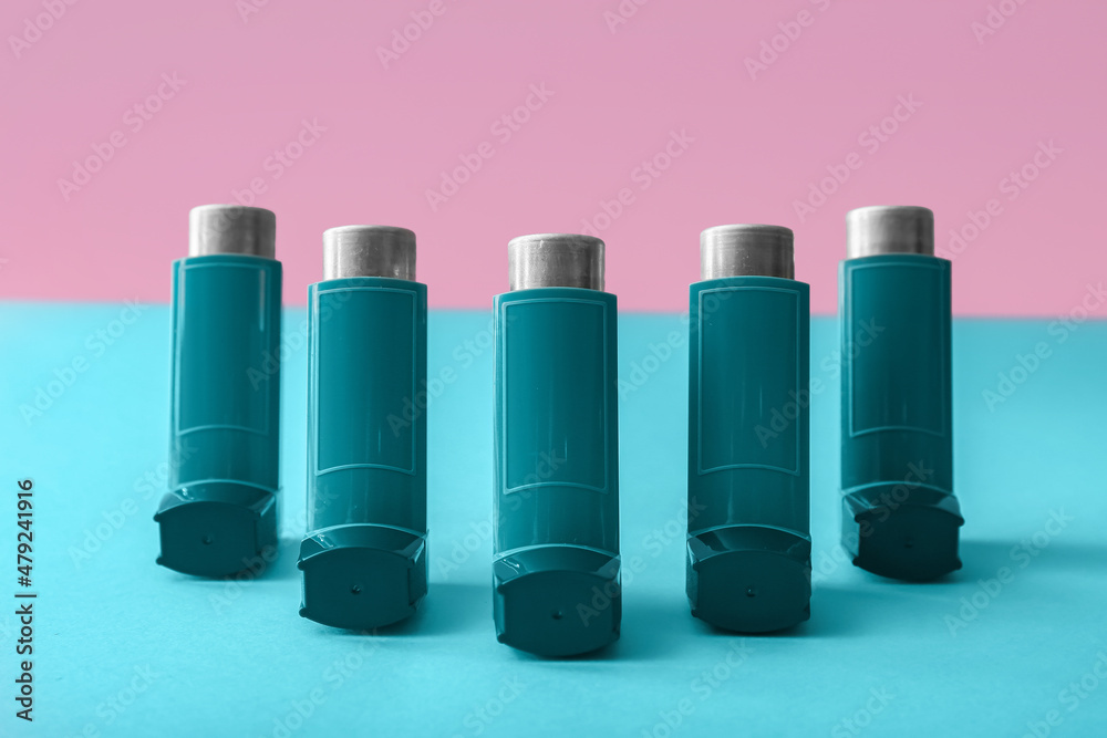 Asthma inhalers on color background Asthma inhalers on color background