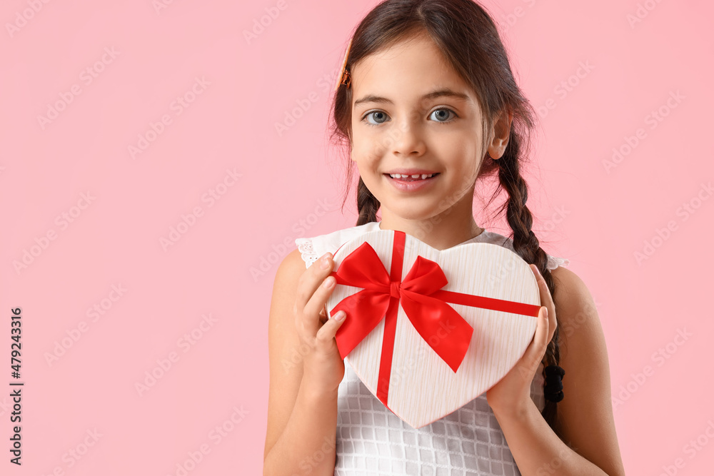 Funny little girl with gift on color background. Valentine's Day celebration Funny little girl with gift on color background. Valentine's Day celebration