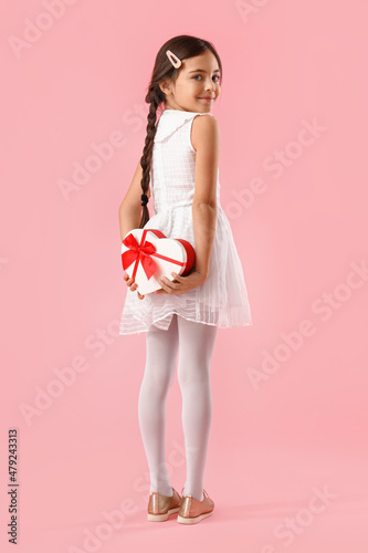 Funny little girl with gift...