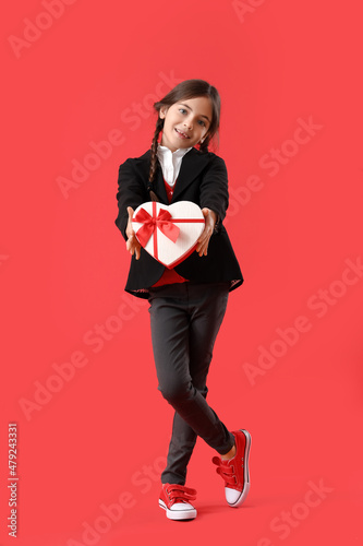 Funny little girl with gift...
