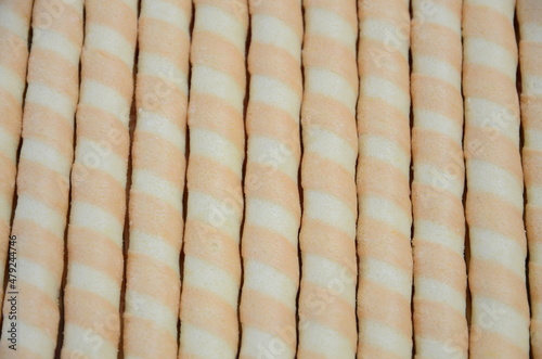 Sweet crunchy tubes lined up as a background.