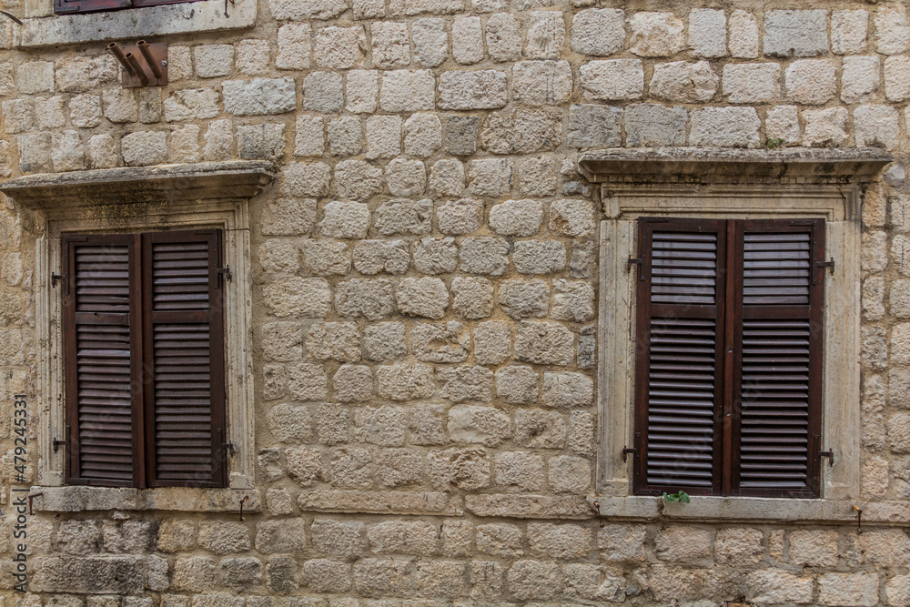 Windows of an old stone building in Kotor, Montenegro.