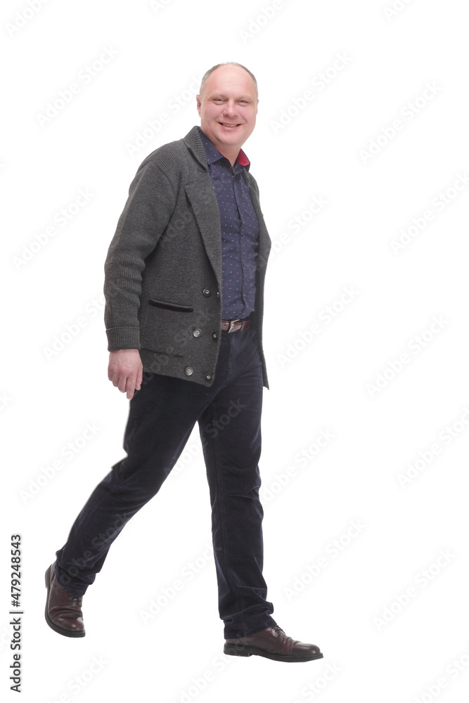 Mature man in casual clothes striding forward. Mature man in casual clothes striding forward.