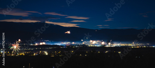 A panorama of fireworks on New Year's Eve. Stunning night city urban shot. . High quality photo