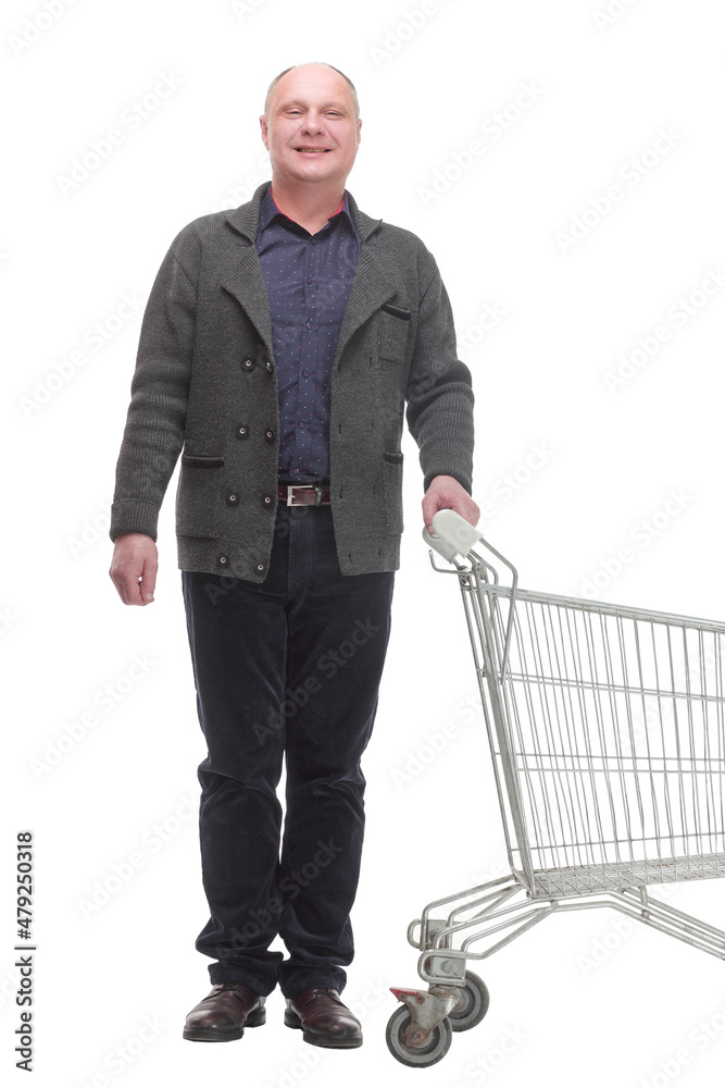 smiling casual man with shopping cart .isolated on a white background. smiling casual man with shopping cart .isolated on a white background.