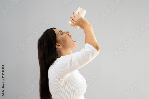 Fotografie Thirsty Woman Drinking Fresh Pure Water