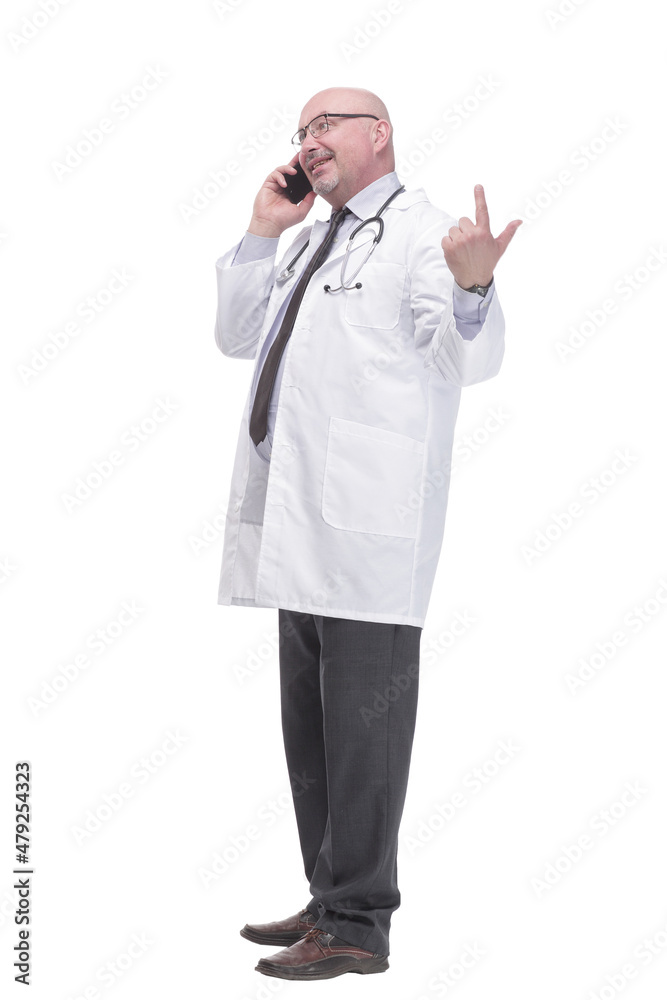 mature doctor with smartphone. isolated on a white background. mature doctor with smartphone. isolated on a white background.